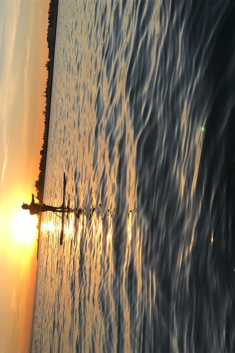 a sunset over a body of water